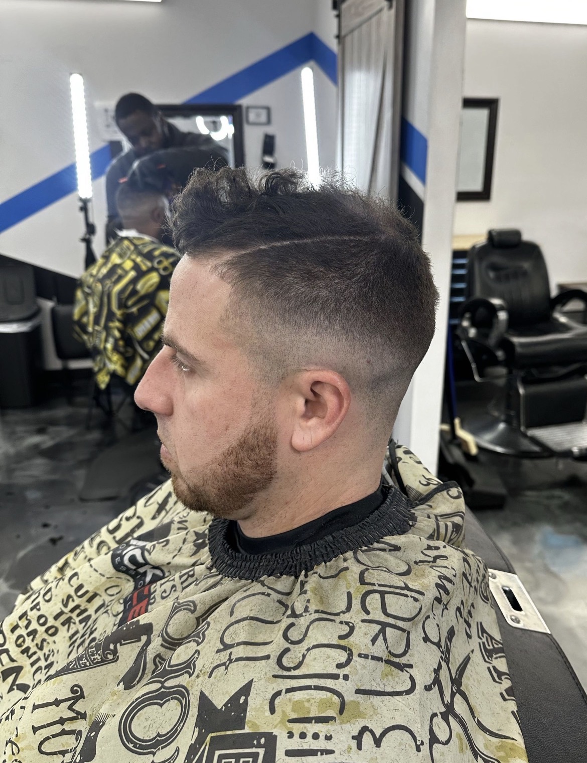 High skin fade with hard part