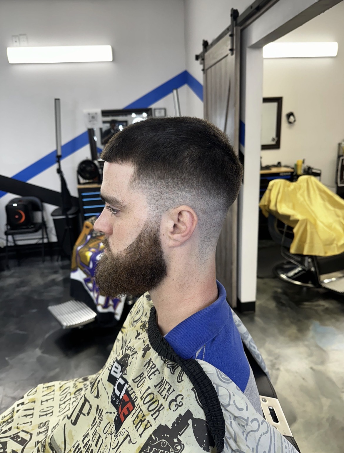 Low taper fade with beard blend
